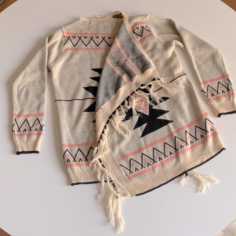 Poncho/wrap sweater with fringe detail